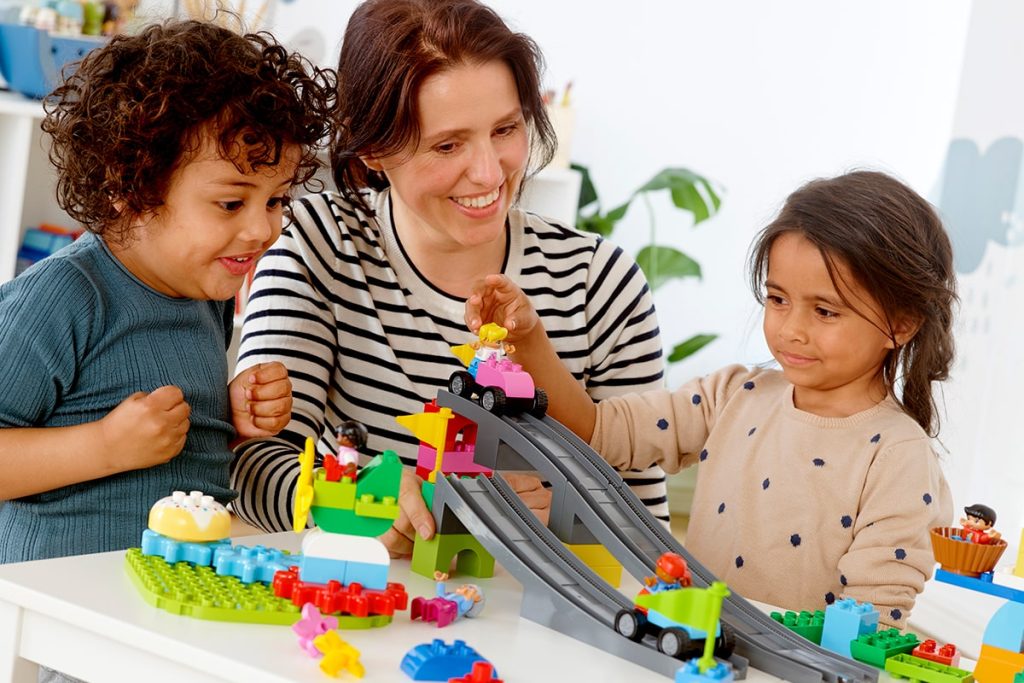 Two young children exploring gravity and motion with LEGO Education STEAM Park